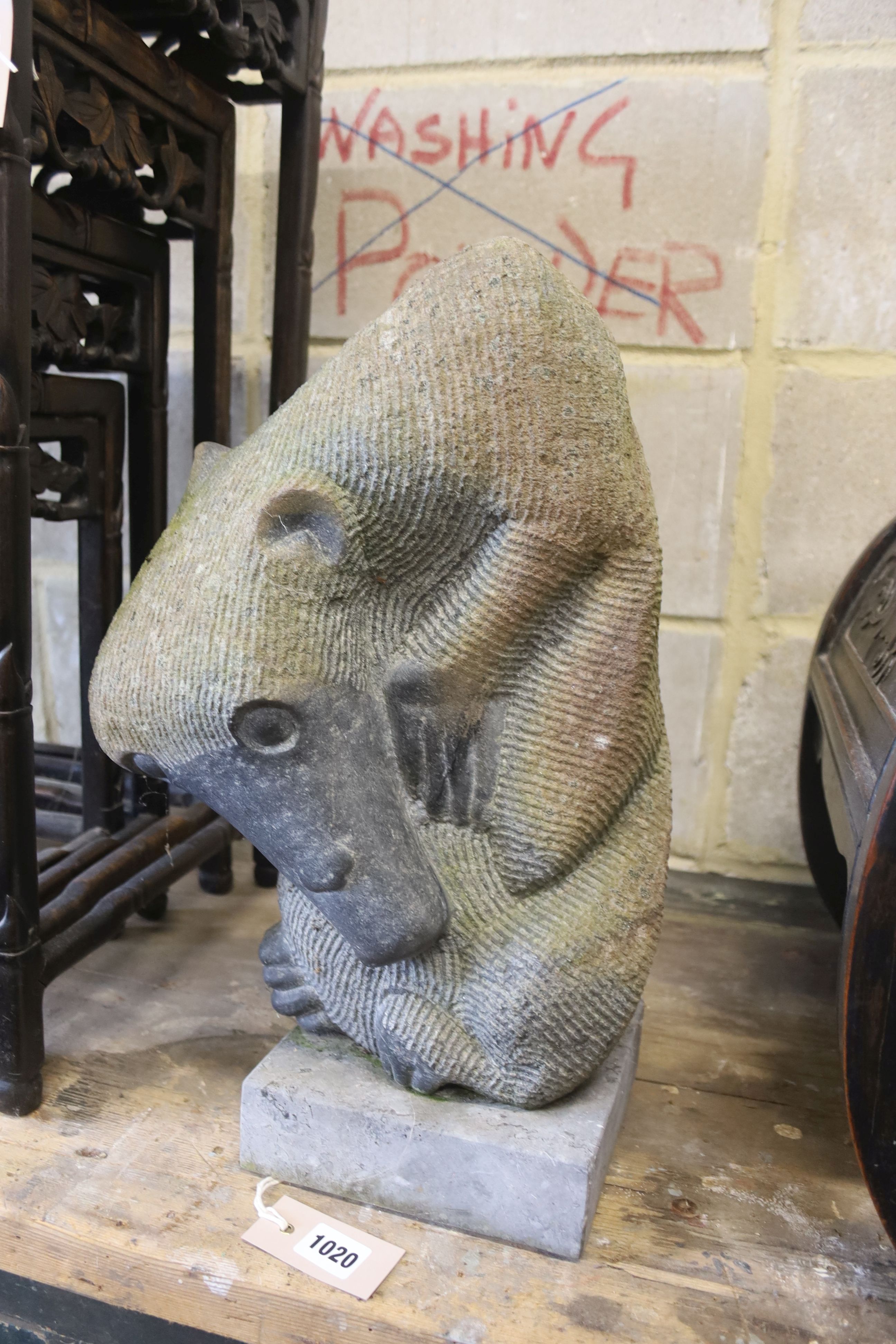 An African carved stone sculpture of an anteater, height 44cm